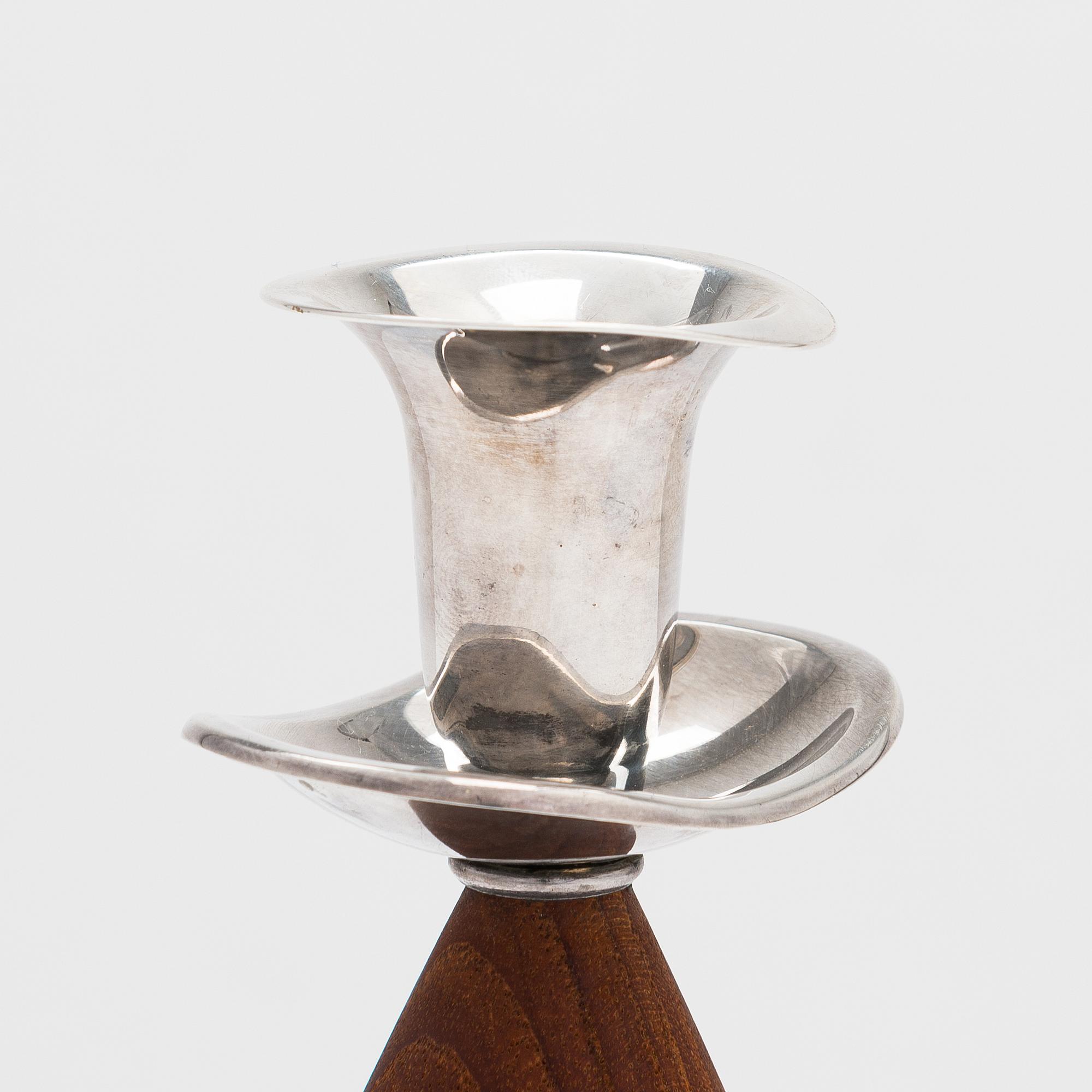 Two pairs of candlesticks, one designed by Saara Hopea, Kultakeskus, Hämeenlinna 1965.