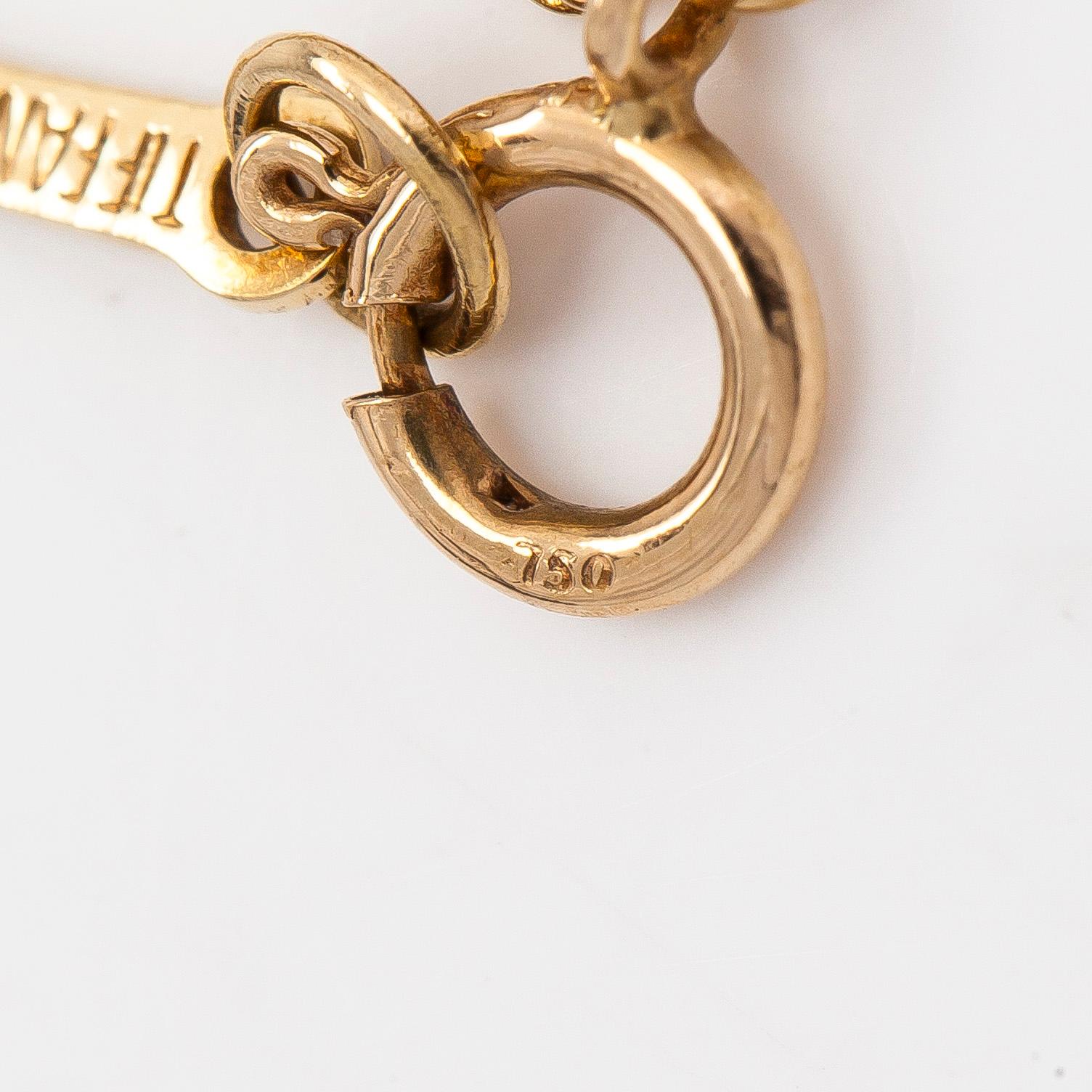 Tiffany & Co, Elsa Peretti, an 18K gold 'Open Heart' necklace with small diamonds.