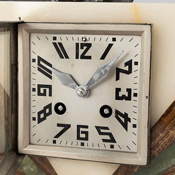 An Art Déco marble mantle clock and a pair of book ends, 1920's.