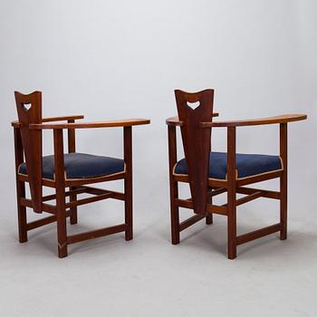 A pair of Arts and Crafts armchairs, early 20th century.