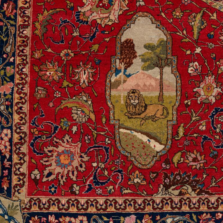 A signed semiantique pictoral Tabriz carpet, c. 269 x 189 cm.