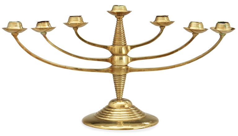 A brass candelabrum after Bruno Paul, Germany, early 20th C.