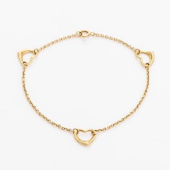 Tiffany & Co, an 18K gold 'Open Heart' bracelet.