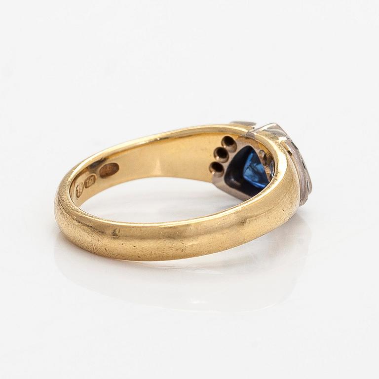 Ring, faceted sapphire, diamonds, 18K gold, H. Tuomaala, Finland 2001.