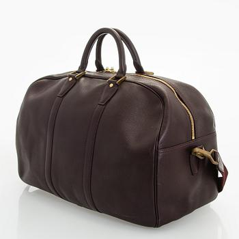 Louis Vuitton, a 'Taiga Kendall PM' weekend bag.