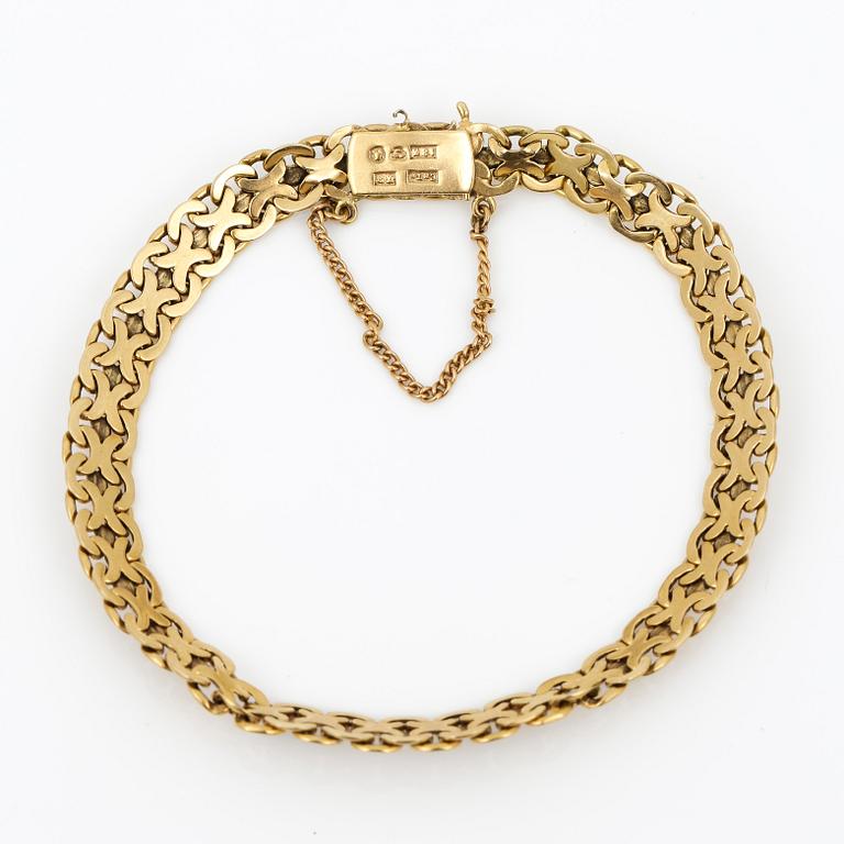 ARMBAND, 18K guld, Thulins Eftr Urhandels, Stockholm, 1936. Vikt ca 13,45 g.