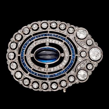 125. A cabochon synthetic sapphire and old-cut diamond, 2.50 cts in total, brooch.