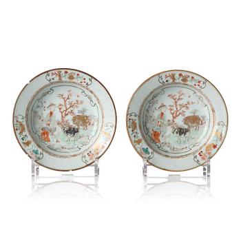 1035. A pair of enamelled dishes, Qing dynasty, Yongzheng (1723-35). 'Trompe-leuille painted'.