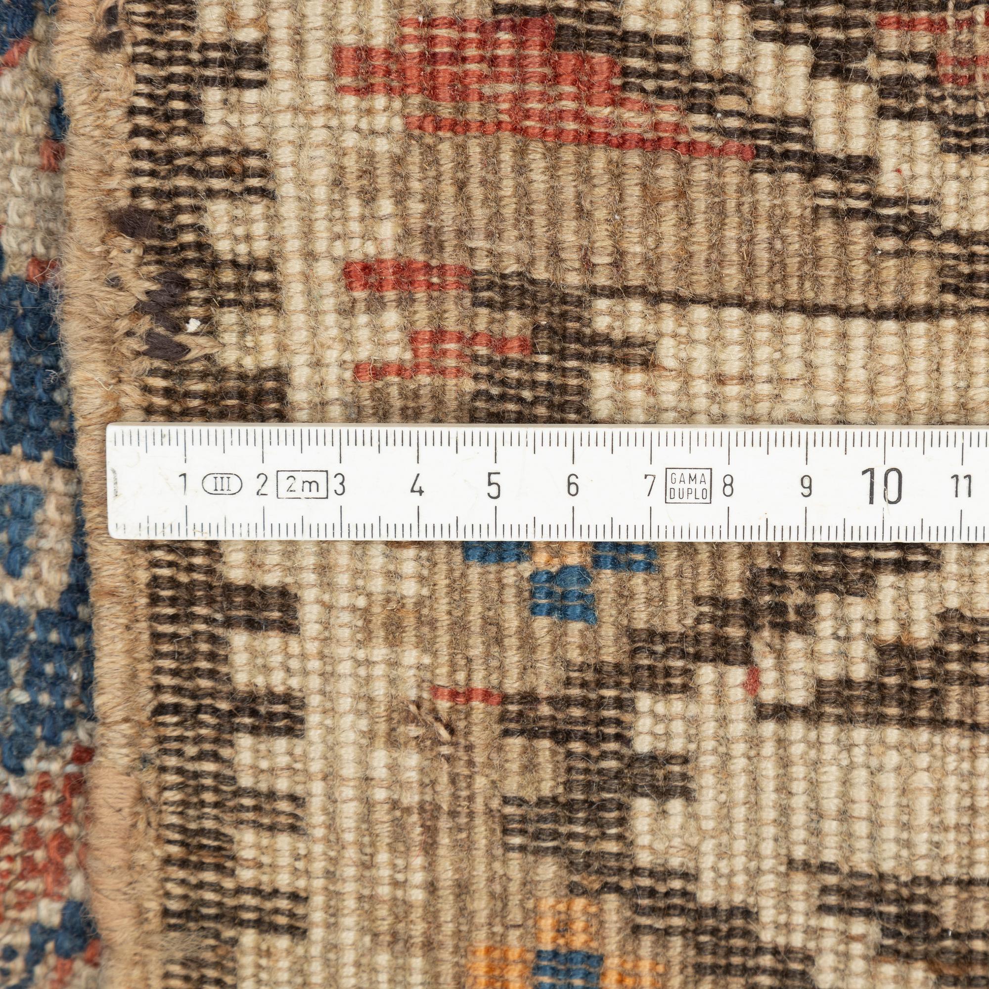An oriental rug, c. 200 x 115 cm.