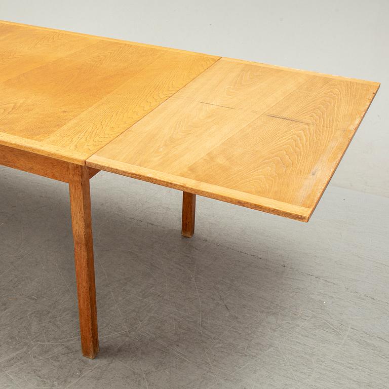 Knud Andersen, a set of six chairs for J.C.A Andersen, Aarhus, Denmark and a dinner table from Troeds, Bjärnum.