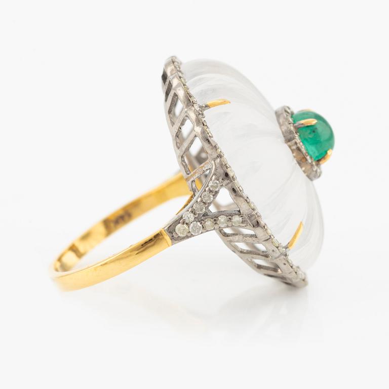 Ring with cut rock crystal, diamonds, and cabochon-cut emerald.