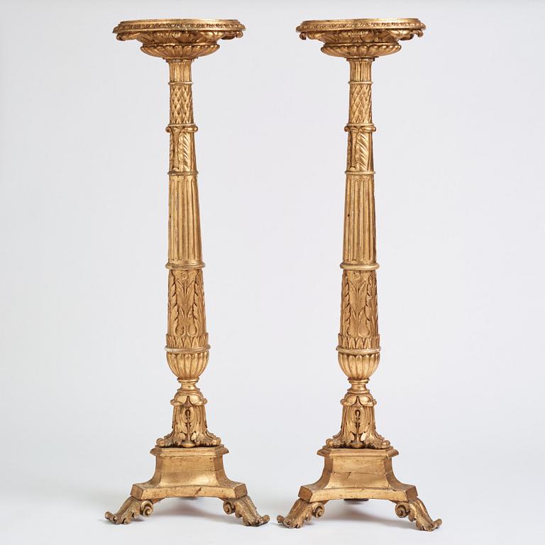 A pair of Swedish Empire giltwood gueridons, Stockholm, first part of the 19th century.