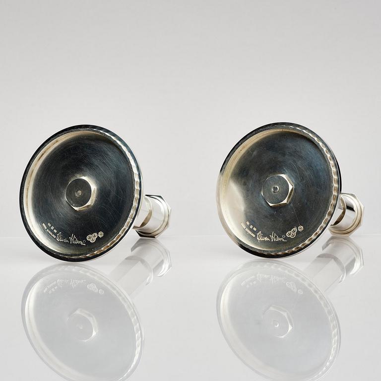 Wiwen Nilsson, a pair of sterling silver candlesticks, Lund, Sweden 11957 and 1960.