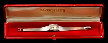 ARMBANDSUR, 18k vitguld med briljantslipade diamanter ca 0,60 ct. "Longines", cikt tot ca 42 g.