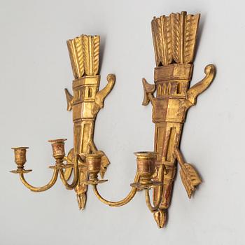 A pair of 19th century carved wall sconces.