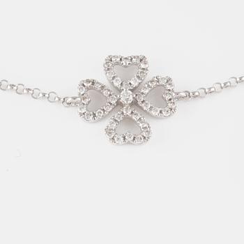 ARMBAND, 18K vitguld med briljantslipade diamanter ca 0.15 ct. Vikt 1,4 gram.