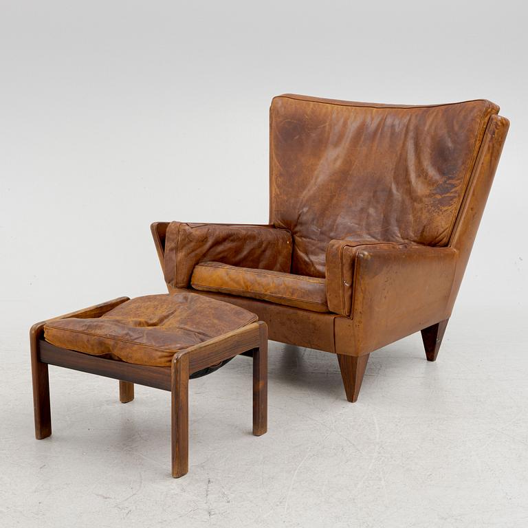 Illum Wikkelsø, a model V11 armchair and an ottoman by other maker, 1960's.