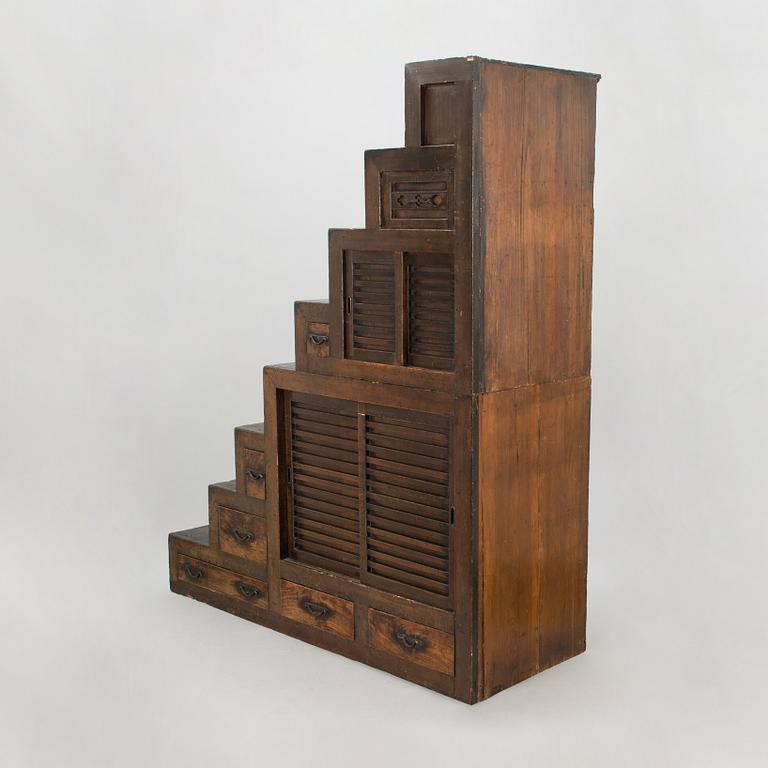 A Japanese chest of drawers / cabinet so-called "Step Tansu" in cedar wood, 19th century.