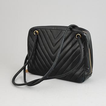 Chanel, a black leather handbag, 1980's.