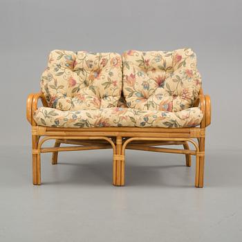 A set of sofa, easy chairs and table in four parts, late 20th century.
