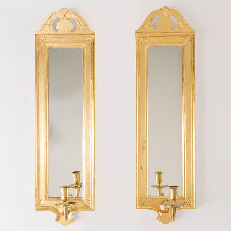 A pair of "Regnaholm" rococo style mirror wall sconces  by IKEA.