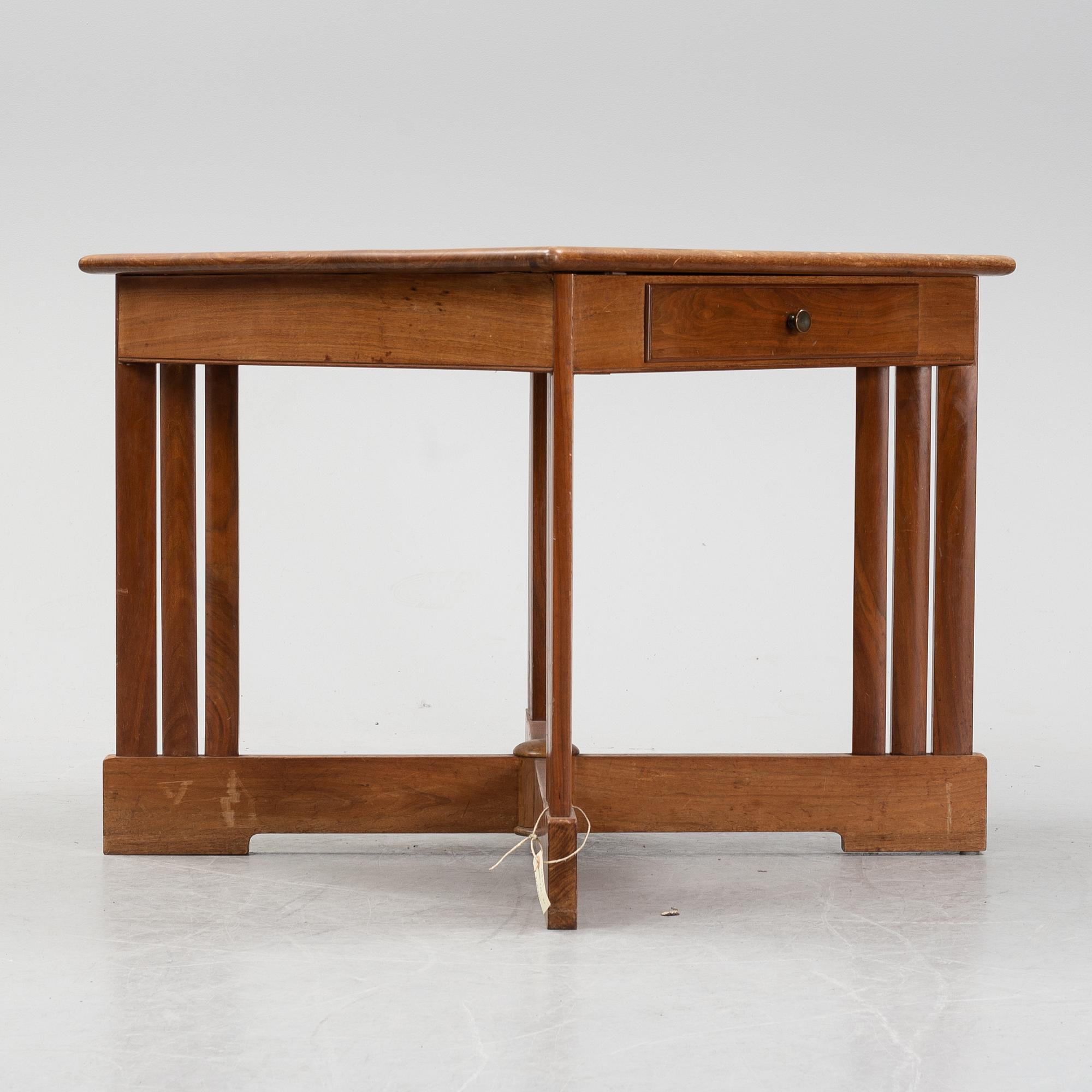 A mahogany and birch center table, 1910's/20's.