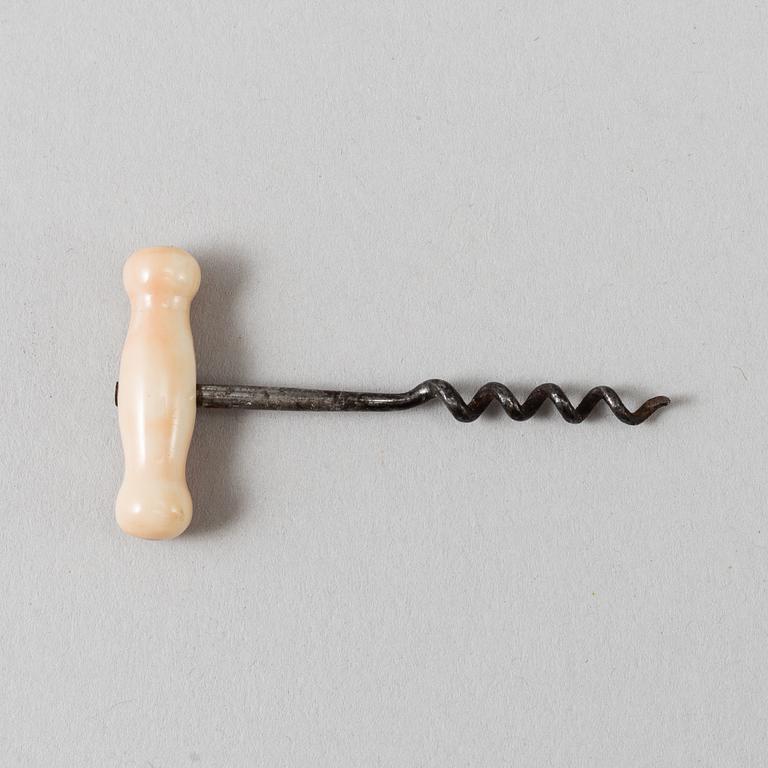 A 19th century bone and steel miniature corkscrew.