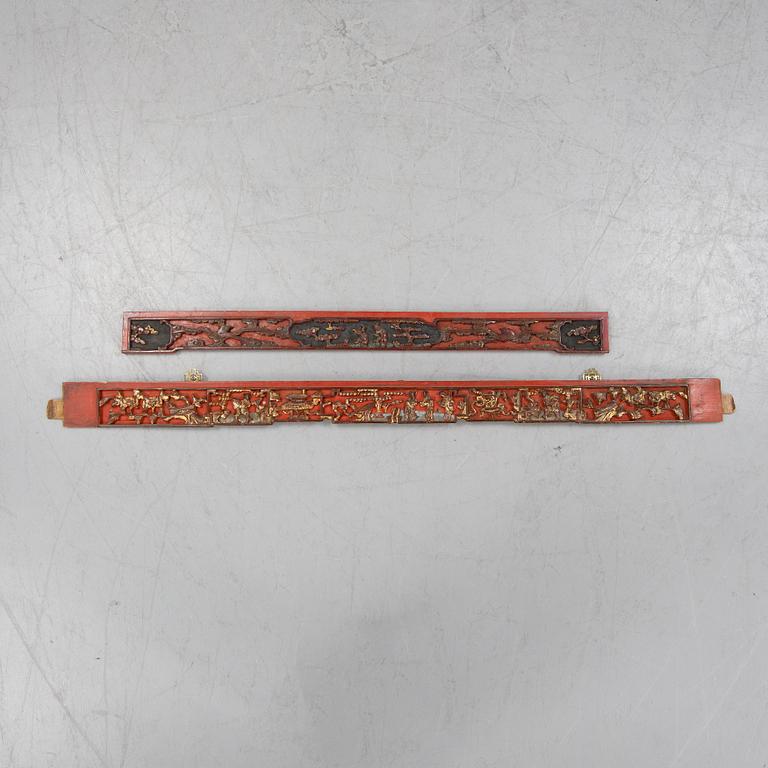 Two Chinese red lacquered wooden panels, 20th century.