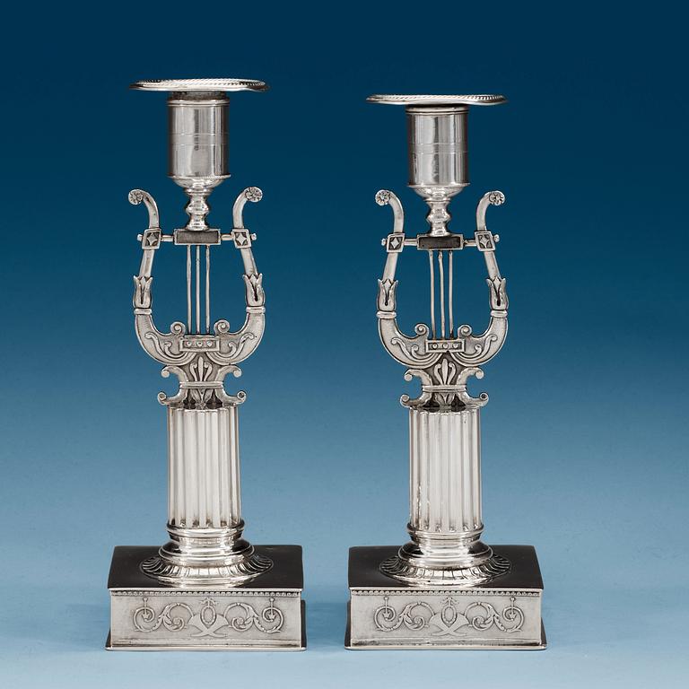 A pair of Swedish 19th century silver candlesticks, makers mark of Johan Petter Grönvall, Stockholm 1823.