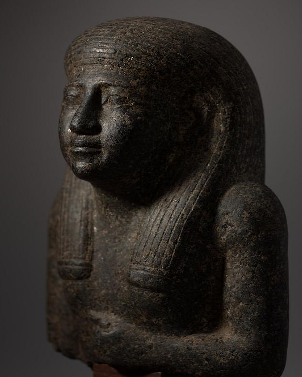 An Egyptian black granite bust of a man, 19th century or older.