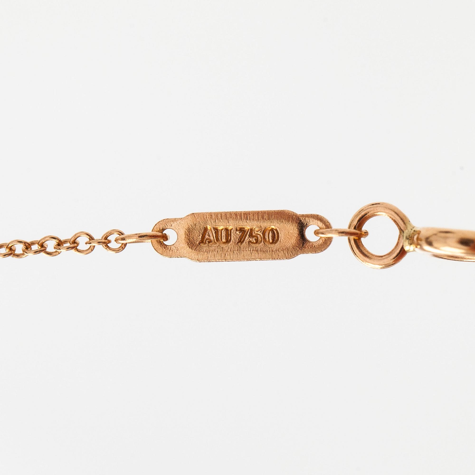 Tiffany & Co, an 18K gold 'T Smile' necklace.