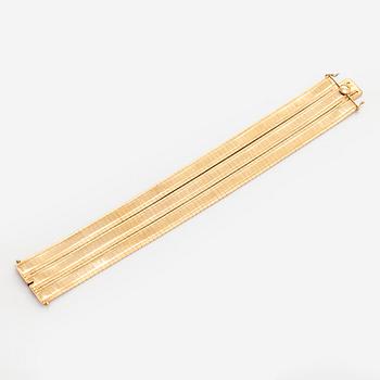 An 18K gold bracelet.