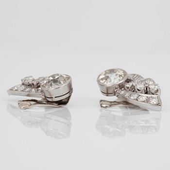 A pair of old-cut diamond earrings. Total carat weight of diamonds circa 5.00 cts. The large diamonds circa 2 cts each.