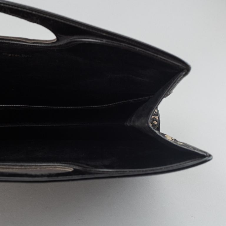 Christian Dior, Oblique fold-over convertible clutch.