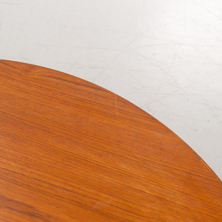 A 1950's/60's teak-veneered dining table.