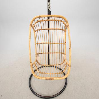 A bamboo and rattan hanging chair from the second half of the 20th century.