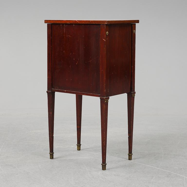 A first half of the 20th century mahogany veneered bedside table.