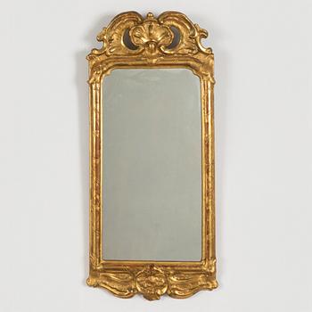 A rococo mirror, mid 18th century.
