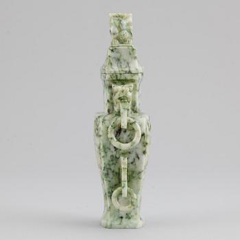 A carved green stone vase with cover, China, 20th Century.