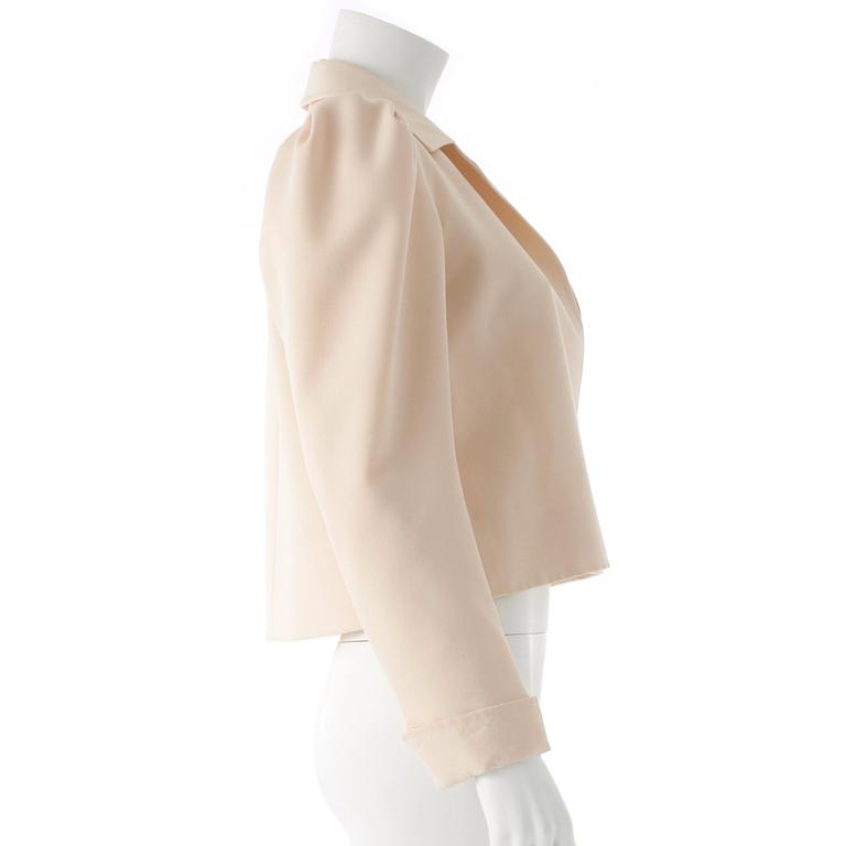 YVES SAINT LAURENT, a creme color silk jacket.