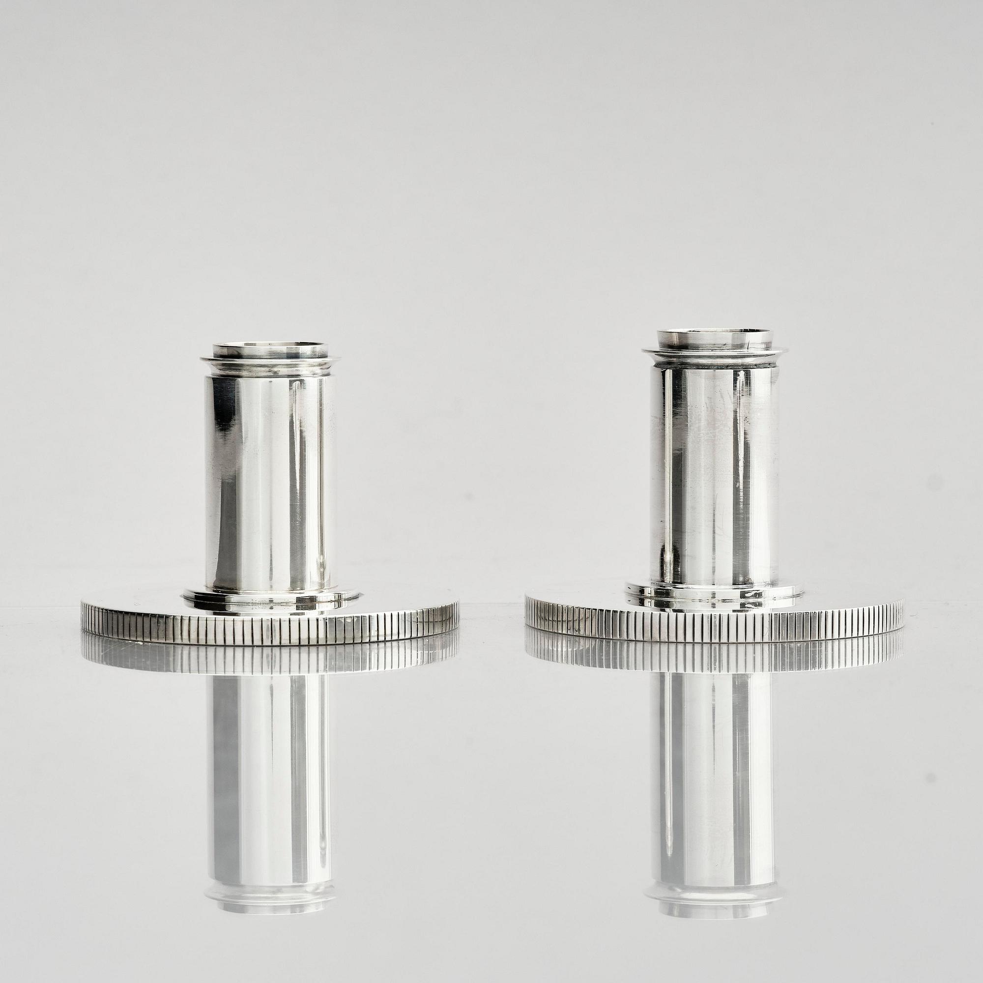 Georg Jensen, a pair of sterling silver candlesticks, design by Sigvard Bernadotte, model no 711A, Copenhagen, Denm after 1945.