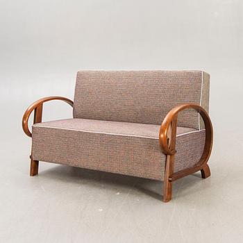 An Art Deco walnut sofa first half of the 20th century.