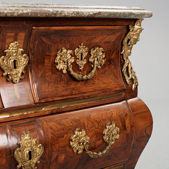 A Swedish early rococo parquetry, ormolu-mounted and marble commode, presumably by S. Pasch or J. Wulf , ca. 1740.