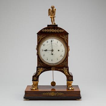 A Biedermeier pendulum clock, Vienna, first half of the 19th century.