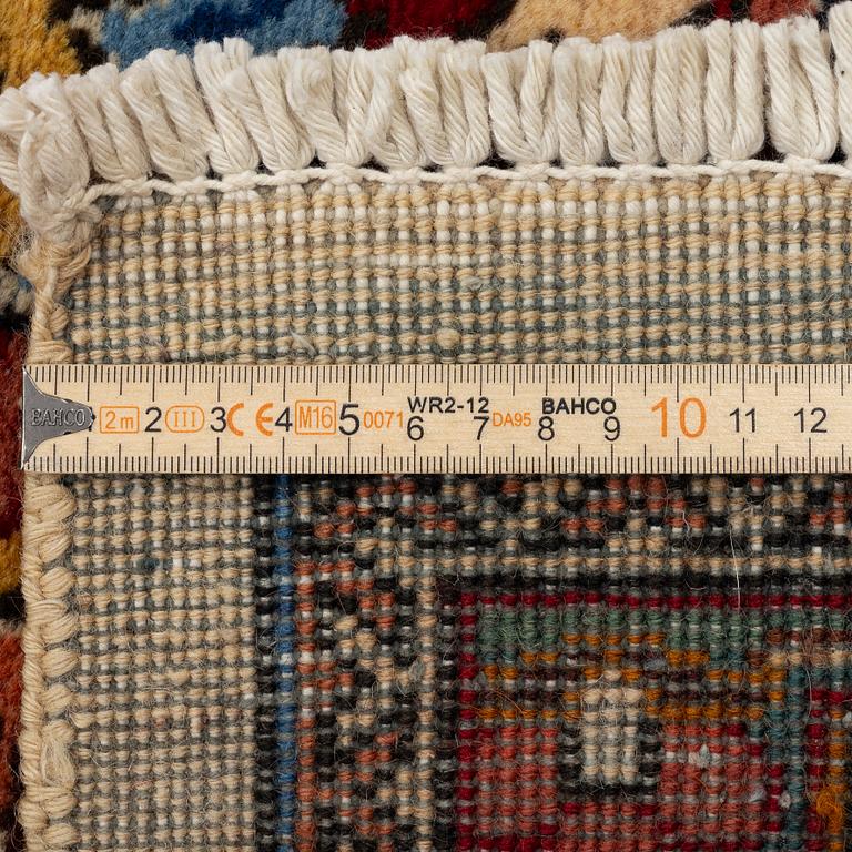 A Tabriz carpet, Northwestern Iran, of Safavid 'palmette' design, c, 483 x 302 cm.