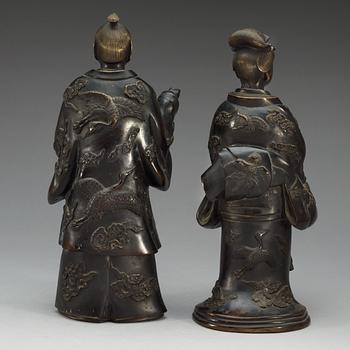 Two standing Japanese bronze sculptures of a Samurai and elegant lady, 18/19th Century.