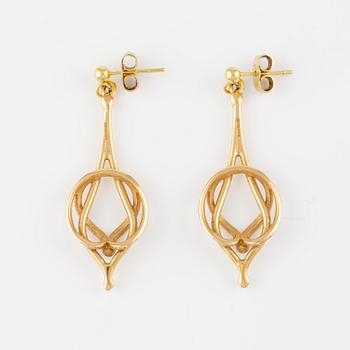 A pair of 18K gold earrings.