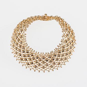 ARMSMYCKE, 18K guld. 1900-talets senare hälft. Vikt 19,3 g.