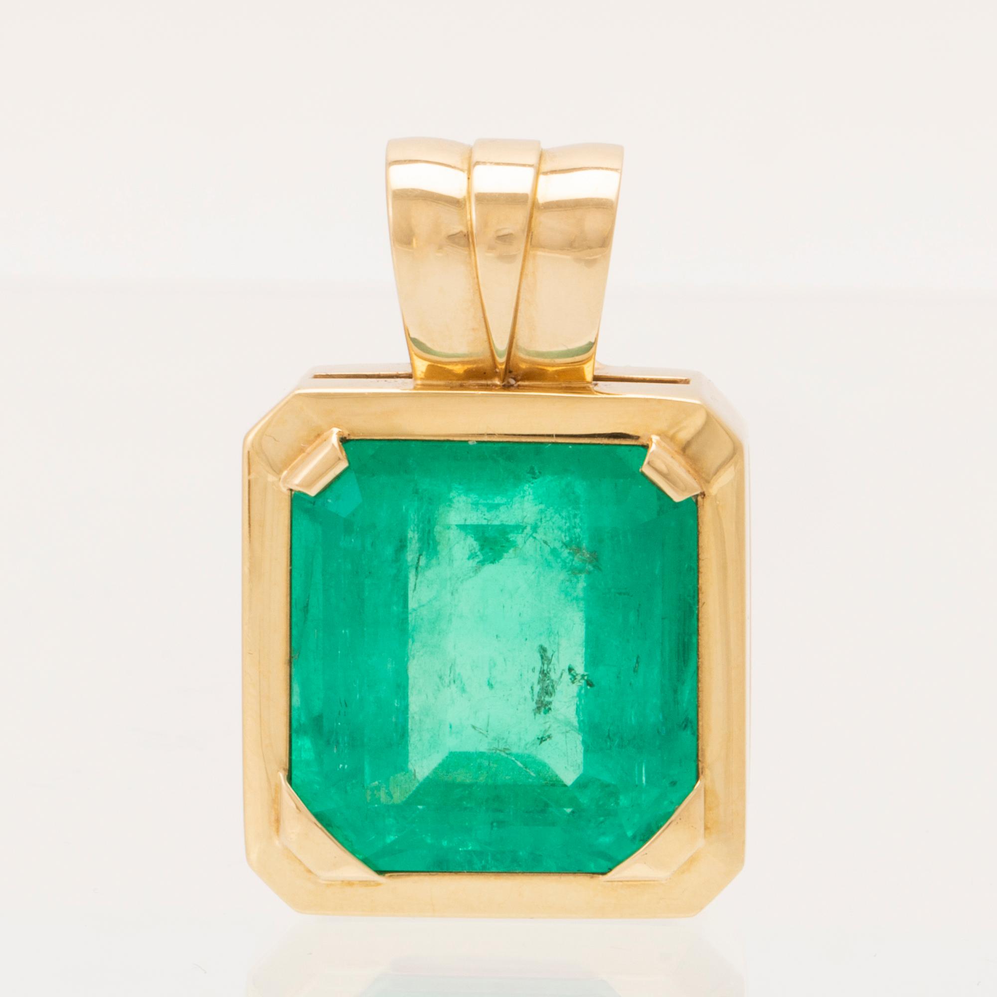 An 18K gold pendant set with an emerald-cut emerald, Schrittesser Gold & Silversmith Gothenburg.