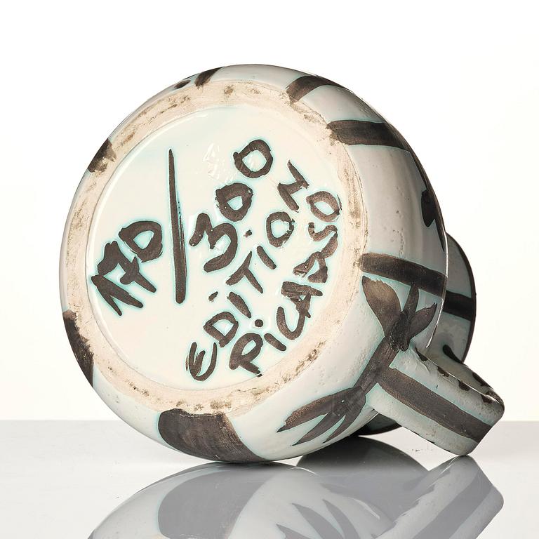 Pablo Picasso, a "Pichet petites têtes" (A.R. 222) faience pitcher, Madoura, Vallauris, France, post 1953.